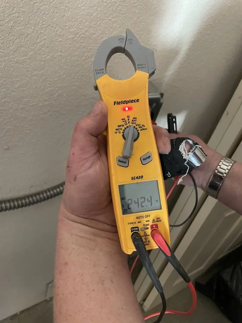 Voltage testing with clamp meter during Electrical Installation Services in Mount Pleasant